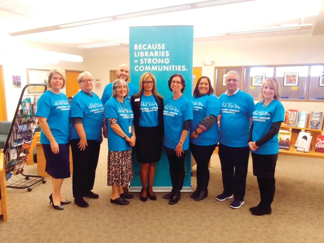 ALL WHO SUPPORT LIBRARIES: Garcia-Febo posed with school staff and librarians in the room who were present for the recognition event, thanking them for their support of both school and public libraries.